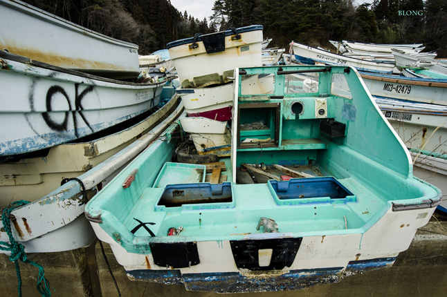 Wrecked boats are stacked and awaiting disposal. Bruno Long photo