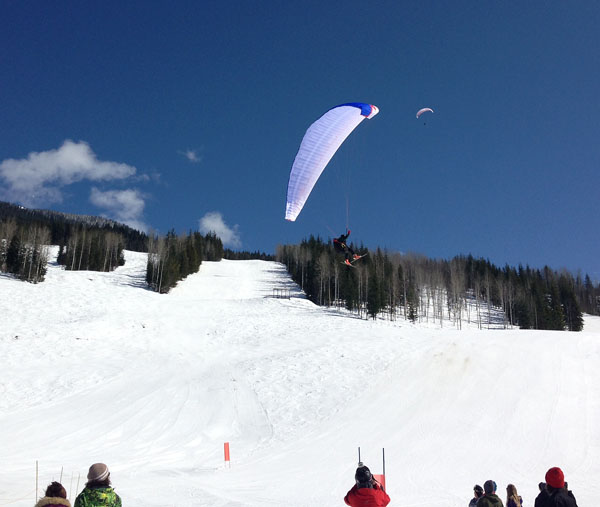 A skier using a parasail comes in for a landing at RMR on Sunday. Skiing conditions were great and so was all that glorious sunshine. Peter Blackmore photo