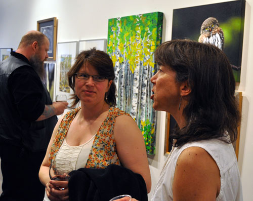 Artists Gwen Lips (left) and Nancy Geismar enjoy a moment together at the ArtFirst! opening. David F. Rooney photo
