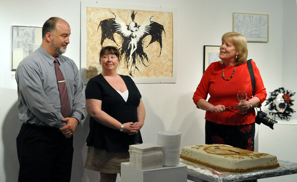 Art Gallery Executive Director Jackie Pendergast (right) congratulates RSS Principal Greg Kenyon and Art Teacher Theresa Browning on the opening of the Revelstoke Secondary School's art exhibition, Don’t Hide the Madness. The show was one of four that opened at the gallery, formerly known as the Revelstoke Visual Arts Centre. David F. Rooney photo