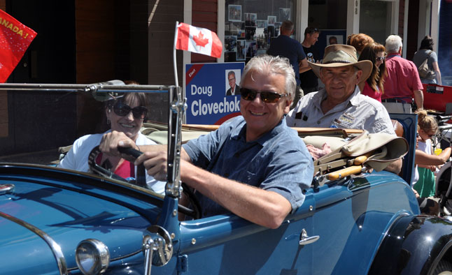 BC Liberal Candidate Doug Clovechok poses with his wife Susan, and — in the rumble seat — Peter Bernacki, vice-president of the party's riding association on Saturday. Clovechok was in town Friday and Saturday to campaign for support. The provincial election is on Tuesday and he anticipates a large turnout. David F. Rooney photo