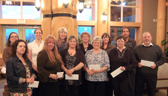 These happy people all represent local groups that have benefitted from the  Revelstoke Community Foundation's philanthropic ethics. From left to right in front are: Andree Rioux of the Hospice Society, which received a grant of $1,500; Marjorie Somerton of the Railway Museum, $700 for its Screen Smart Smart Leggo Creation Event; Sue Davies of Bear Aware, $2,000 for its fruit reduction program; Patti Larson, representing Community Connections; $2,500 for each of three programs, the Food Bank, a Nutrion Education Program and the Summer Day Camp; Cathy English of the Museum & Archives, $1,000 for its Children's Multicultural Activity Centre; and Garry Pendergast of  the Arts Council, $1,500 to hold live performances in local schools. In back are: Jennifer Barrett and Sami Lingren of the Revelstoke & District Humane Society, $1,50 for its spay/neuter program; BR Whalen of the Multicultural Society, $1,500 for the Carousel of Nations program; Linda Chell of the Community Childcare Society, $1,500 for the Big Eddy Playground Rehabilitation project; Josie McCulloch of the Columbia Basin Alliance for Literacy, $2,000 for its literacy programs; and Federico Osorio of the North Columbia Environmental Society, $1,900 for an environmental education coordinator. David F. Rooney photo