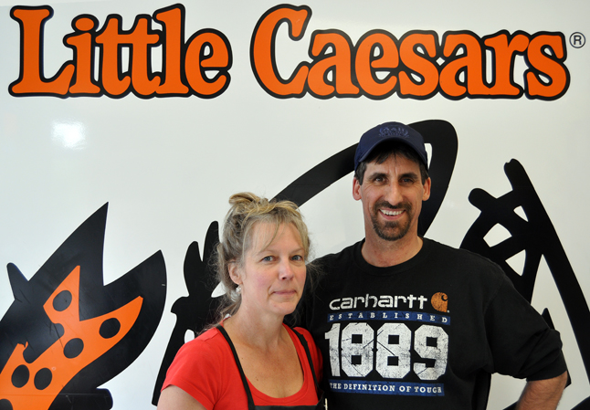 Jeff and Jeanie Weston and their son Nathan had high hopes when they bought their Little Caesars franchise seven years ago. But now, no matter how they slice it, their business is toast at the end of May. David F. Rooney photo