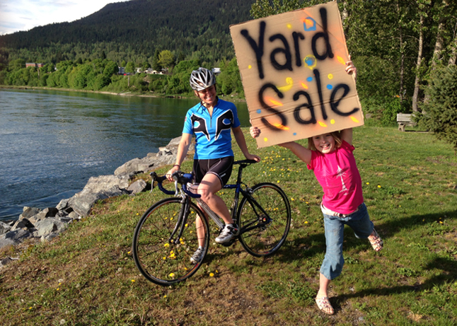 Sally Carmichael is heading east to ride in the 200 km Enbridge Ride to Conquer Cancer in southern Ontario. Her daughter, Holly, is an enthusiastic helper and is helping promote a monster yard sale on Seventh Street later this month. Photo courtesy of Sally Carmichael