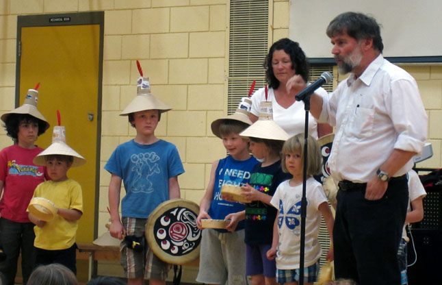 (left to right) Esteban Awad, Luca Gallant, Liam Freathy, Felix, Freathy, Tamara Lovett, Audrey St. Onge, and teacher Annick Gagnon from École Glacier dressed up for a presentation for Arrow Heights Elementary School on May 10 in the AHE gym.  The Aboriginal Education presentation was led by Roger Lagassé.  Mr. Lagassé is a resource teacher in Aboriginal Education for the Francophone School District. Photo by student photographer Julian Corbett