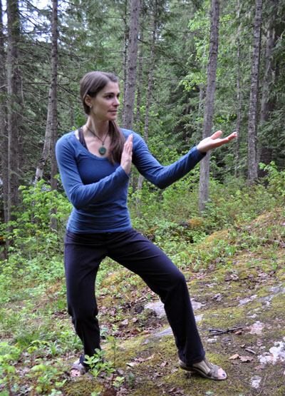 Tai Chi teacher Eve Wolters poses in the cross-bow stance on a ridge at Monashee Mandala on Monday afternoon. David F. Rooney photo