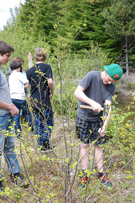 Students Kevin Kepler and Jordan O’Neill taking part in the Martha Creek Riparian Restoration Project. Photo courtesy of the Columbia Basin Trust