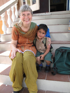Principal and school cofounder Lori McFadyen takes a quiet moment with little Aman. Click on the image to see it at full size. Laura Stovel photo