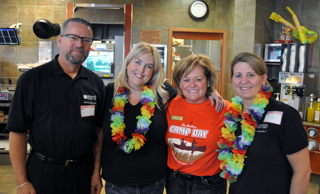 Wednesday, June 5, was Camp Day at Tim Hortons and a number of people from around town donated their time to help serve customers and raise money for charity. Last year's Camp Day raised $11 million. Tim Hortons franchise coowner Donna Leompte (in red) was ably assisted by Wes Groen, Lyska Fullerton and Carol Hascarl. David F. Rooney photo
