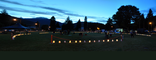 As the last light drained from the western sky relayers made their last lap past the flickering luminaries. David F. Rooney photo