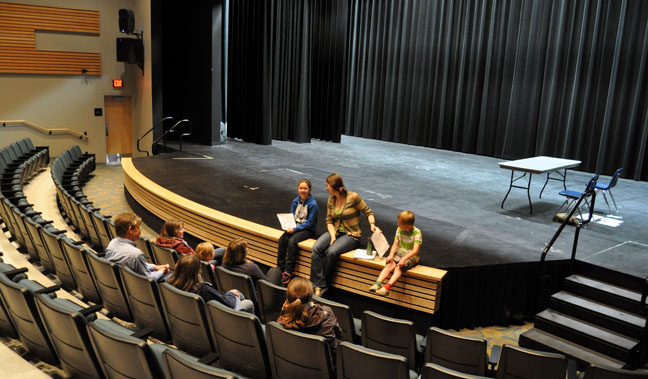 Actress Miranda Allen (center), an RSS grad who has gone on to build a career in theatre, talks with parents and a few of the kids who came out to audition for parts in Theatre Prospero's July 19 production of Williamn Shakespeare's classic A Mid-Summer Night's Dream. David F. Rooney photo