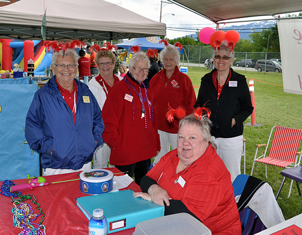 If you were seeing red there was nothing wrong with your eyes. The ladies of the Hospital Auxiliary not only wore red, but sported feather red deely-boppers, too. David F. Rooney photo