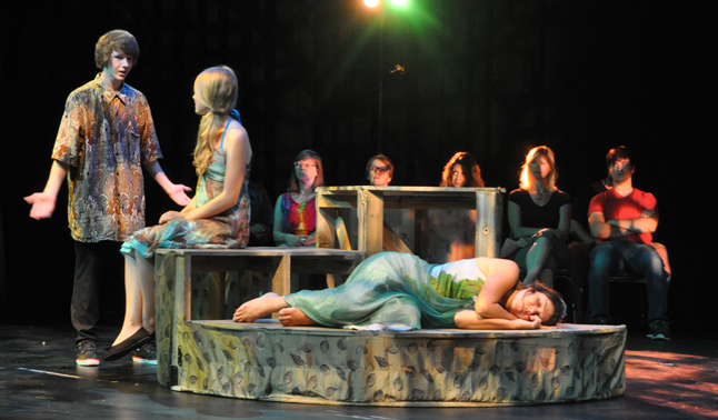 Lysander (Grayson Noseworthy) declares his love for the fair Hermia (played in this scene by Erin Behncke) and Titania sleeps, unnoticed behind them in the forest. David F. Rooney photo
