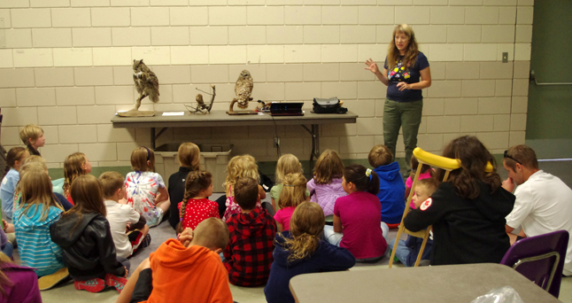 Children enrolled in the library's Summer Reading Club learned about how owls hunt and eat during a special presentation on Wednesday, led here by Lucie Bergeron. Photo courtesy of the Revelstoke branch of the Okanagan Regional Library