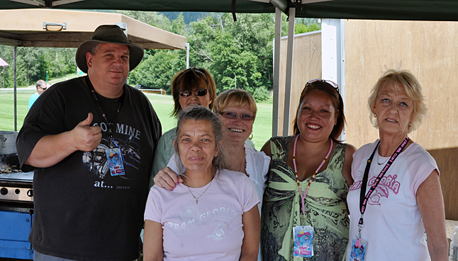 The folks from Team Gloria — Wayne Murray, Maura Dower, Carolyn Murray, Giinger Shoji, Mary Spencer and Chris Deverall — pose for a photo in their concession stand at Timber Days. They whipped burgers, dogs and other typical fare. The group raises a logt of money each year for Cancer Society, the local Cancer Support Group and other organizations. They raises $8,606 at the Relay for Life all by themselves. David F. Rooney photo