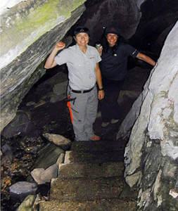 Alice Weber (left) and Sarah Boyle pose on the steps leading down into the Nakimu Cave system in Glacier National Park. Mandy Kellner photo courtesy of Parks Canada