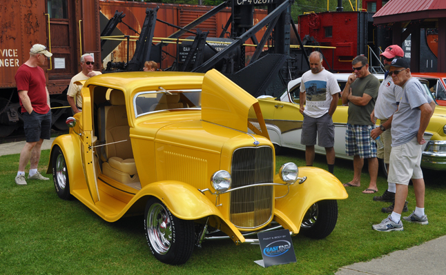 One of the most-admired vehicles was this 1932 Ford. It looks great but its owner Don Hawker (second rom the left in back) admitted that it's a faux '32 Ford. "It's not an original," he said. "But neither are a lot of the '32 Fords s you see on the road these days," he said. There are probably more 1932 Fords on the road now than there were in 1932." That may well be true but it's still a gorgeous machine. David F. Rooney photo