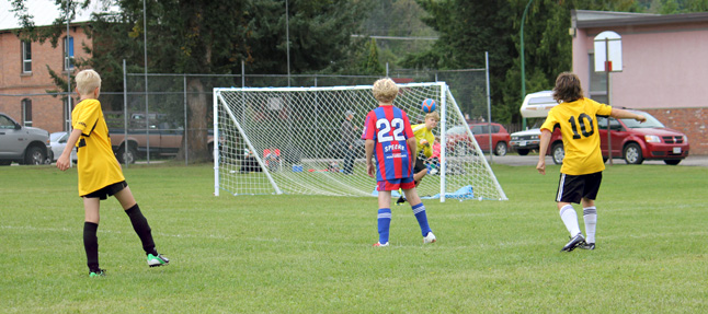 Revelstoke Goalie David Kline gets a fist on the ball to make the save during one of this weekend's Little Bear Soccer Tournament matches. Linda Chell photo