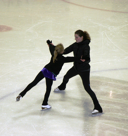 Jadene Ferreira helps a young skater perfect her move. Jadene is a professional figure skating choreographer and performance coach. She and her husband Ben conducted the local figure skating club's first professional workshop. Photo courtesy of Jennifer Walker-Larsen