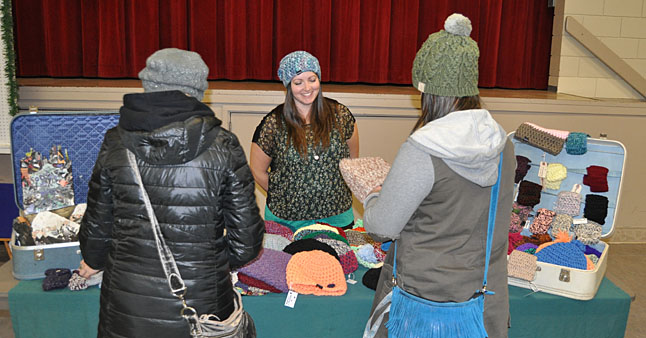 You'll never guess what Amanda Raccah was selling at her table. This knitter-extraordinaire spends a lot of free time knitting beautiful scarves and toques. If you missed this year's No Host Bazaar you can still her work on display at Sangha Bean Cafe on Connaught Avenue at First Street Wes, right across from Shannon McKee's Telus store. David F. Rooney photo