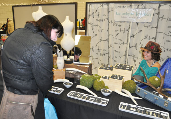 Jeweller Cat Caddogan chats with a shopper at the bazaar. Cat's jewellery can also be found at Garnish on Grizzly Plaza. David F. Rooney photo