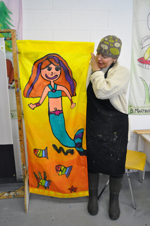 Artist and banner instructor Tina Lindegaard shows a very cute children's banner she particularly liked. Tina and fellow instructor Jackie James can assist banner creators of any age with almost any question or problem. Revelstoke Current file photo