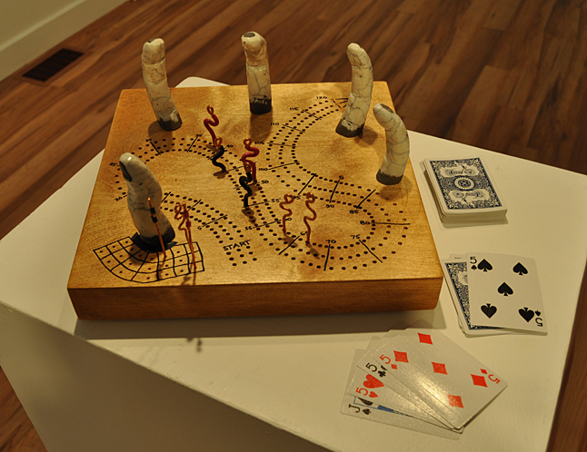Here's something you don't see every day: A kind of haunted cribbage board. It looks like it might have been owned by the Addams Family. The artist who created it told me he was having fun when he made it. The game board comes with cards and pieces, which can all be kept in a built-in container underneath the board. David F. Rooney photo