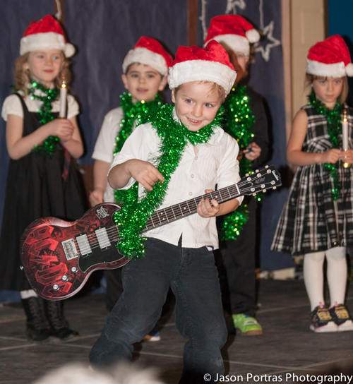 Kindergarten student, Phoenix Portras, rocks out the guitar solo. Jason Portras photo