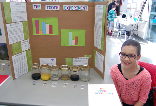 Samantha Veninsky has a very nice smile for the camera. Sadly, her science project demonstrates the damage done to people's teeth by some of Canada's most popular drinks. David F. Rooney photo