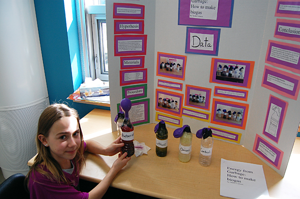Saelin Cadieux demonstrates how different materials produce biogases when they decompose. Those gases can be collected and used as energy sources. David F. Rooney photo