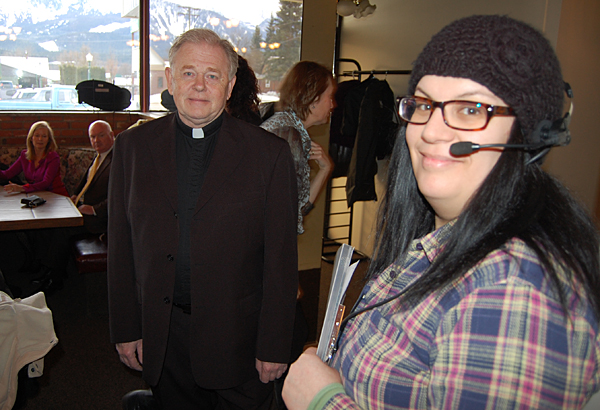 Film crew assistant Victoria Van Leur (right) smiles as Peter Waters shows off his ministerial togs. Peter, a long-time local actor, was tapped to play the minister during the wedding scene. David F. Rooney photo
