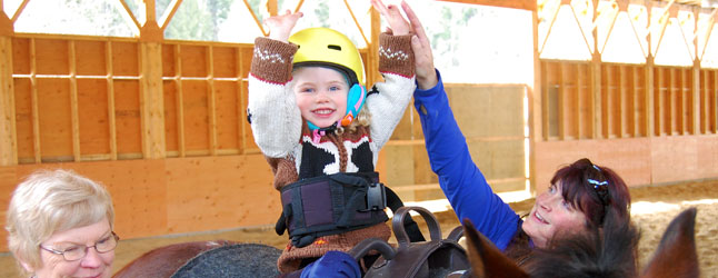 Tanya Secord’s new Therapeutic Riding Program at the Selkirk Saddle Club is bearing some remarkable and heart-warming fruit — the beaming smiles on the faces of its small students and tones of wonder in the voices of their parents. “It has been eye-opening to see her comfort and self-confidence growing with every session,” Kaleigh Thomson said of her three-and-a-half-year-old daughter Neava. “Eventually she’ll be able to do this on her own.” David F. Rooney photo