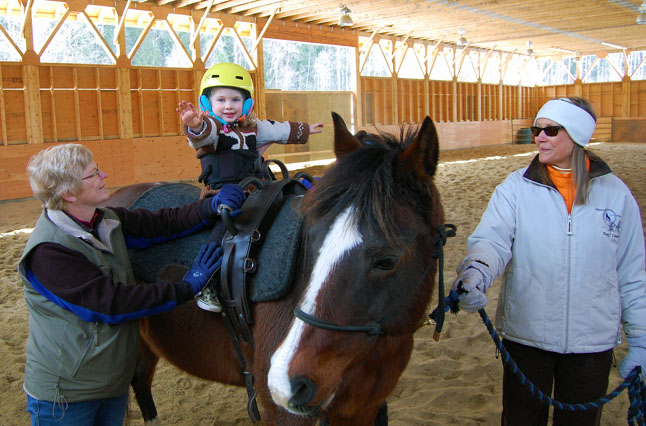 Look, Ma, no hands! Her riding lessons are giving three-and-a-half-year-old Neava confidence her parents hope will stay with her as she gets older. David F. Rooney photo