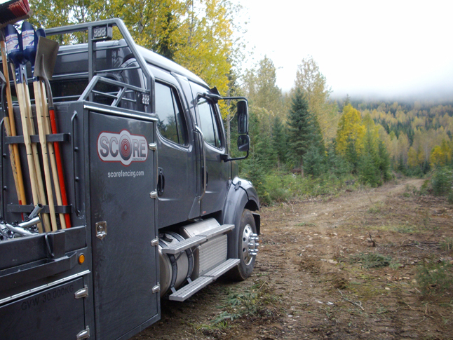 Score construction's truck noses along the road to the pen. Cory Legebokow said the company was one of many iocal firms involved in the project in one way or another. Photo courtesy of the Caribou Maternity Penning Project