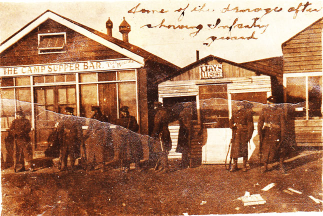 The infantry guarding the camp services soldiers called Tin Town. These shops, bars and restaurants had been looted during the riot.