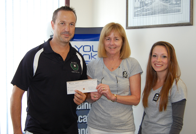 Const. Mike Shannon of Trees for Tots (left) was presented with a $1,000 cheque by RCTV/YourLink's Cheryl Thompson and Marissa Reyes (right) on Wednesday, August 13. The cable company had received $1,000 to donate to a worthy charity after it won the Best Customer Service Story in the Canadian Cable Systems Alliance's I Heart Local Cable campaign.  Here's the submission that Cheryl wrote that triggered that donation:  "A few years ago here at Revelstoke Cable, a division of YourLink Inc., we had an elderly customer who loved her television and even treated herself to some digital channels, even though she lived on a very limited income. "One day she came into our office and was very upset. Her television had broken and she had no money to repair or replace it, so she would have to disconnect her only source of entertainment. After she left out office we remembered one of our staff had brought in an older TV after they had purchased a new one. It was still in great working condition. "We quickly loaded the TV into ne of our vans and the tech headed over to her residence. When the tech explained he was there to deliver a TV she cried with happiness. Since she didn't even have a phone she made the tech phone the office on his cell and, through her sobs, she couldn't thank us enough. No one had ever done anything so special as this for her. "When she had to move a year later she proudly came into our office and said she didn't have room to take the TV with her, so she paid it forward and gave it to someone else who really needed it. "It was our turn to shed the tears. We all went home that day with smiles on our faces and a warm feeling that we had let another customer know just how special they are." Trees for Tots lets people know just how special they are, too. The local charity is locally supported by individuals and small businesses, like RCTV/YourLink,  in our community. Trees for Tots Treasurer Linda Beerling said that in the last 18 months the charity has helped out 22 different Revelstoke families by helping defray the costs of 47 out-of-town trips to doctors' appointments and/or hospital stays. The total cost of these trips was $21,559. Neighbours helping neighbours — it doesn't get much better than that. David F. Rooney photo