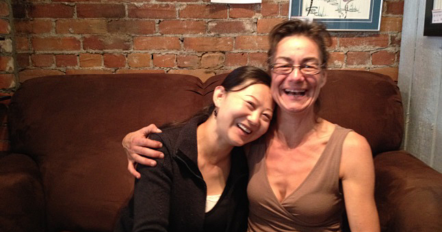 Lu Si, a recent immigrant from China, shares a moment with Janet Pearson. Janet owned Talisman Trading Company, a popular store on Mackenzie Avenue that sold gifts and clothes, often made by local or regional artists. A recent immigrant from China, Lu Si, was looking for work and Janet took a chance and hired her. “I was so nervous,” Si said. “I was so afraid that nobody would hire me.” Community-minded Pearson liked Lu when she first met her. She said she took a chance because she wanted “to support Lu as a woman starting out in a new community and as a new Canadian.” Laura Stovel photo