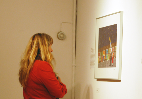 Lucie Bergeron appears enthralled by Jackie's work, Catch a Falling Star. David F. Rooney photo