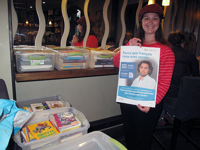 Six times a year a vehicle loaded with French-language books and magazines for children and adults alike rolls into Revelstoke and parks outside La Baguette. This is the Bibliobus organized by the Association des Francophones des Kootenays Ouest. The driver on Thursday was Lise Godin who hauled tupperware boxes of books inside the popular cafe to make them accessible for one pre-arranged hour. "Revelstoke is a good place. We get a bunch of people who come out - 15-20 at least." The Bibliobus also visits schools in the region. The library on wheels visits Revelstoke once a month from September to November and from April to June. People wanting to borrow books need to be AFKO members ($12 for individuals and $20 for families). Godin also mentioned a special opportunity for those wanting to take the international French test. Normally the test costs $80 but AFKO members can take it for free until November. Call 250-352-3516 for details. For more information see http://www.afko.ca. Laura Stovel photo