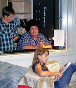 Aleks Klassen and Riley Olson man the sound booth while stage manager Brynn Hoshizaki reads through the script. Natelle Fitzgerald photo