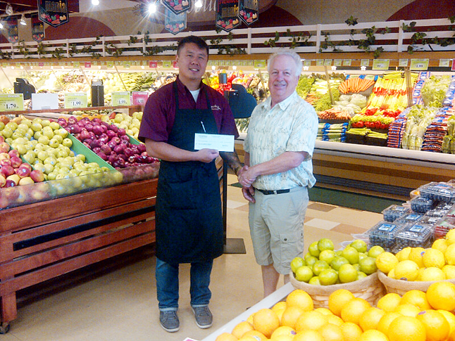 Chad Lee, manager of Southside Market presents Darryl Willoughby, chairman of the Revelstoke Community Foundation, with a cheque for $757.20. These are the proceeds from the Southside Community Rewards fundraiser held this past spring. Topped up with hot dog sales from two weekends this summer the total amount raised was over $1,300. Thank-you to Chad and Southside Market for coordinating this event and choosing the Revelstoke Community Foundation as it's receiving charity. Photo courtesy of Steven Hui / Revelstoke Community Foundation