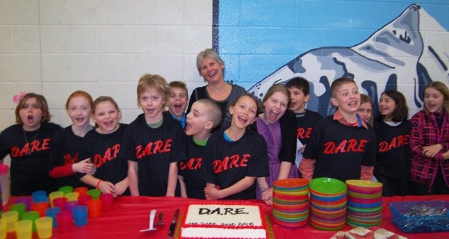 They also celebrated with a tasty cake, courtesy of Cooper's. Here are some of the young DARE grads posing with teacher Sue Leach. David F. Rooney photo
