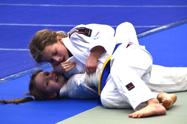 Ruby Serrouya Pinning her opponent in her first match. Photo courtesy of the Revelstoke Judo Club