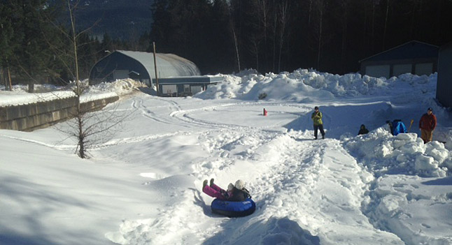 Eeeee-Hah! It's hard to beat the fun of tubing down a snowy slope. Photo courtesy of the Revelstoke Rotary Club