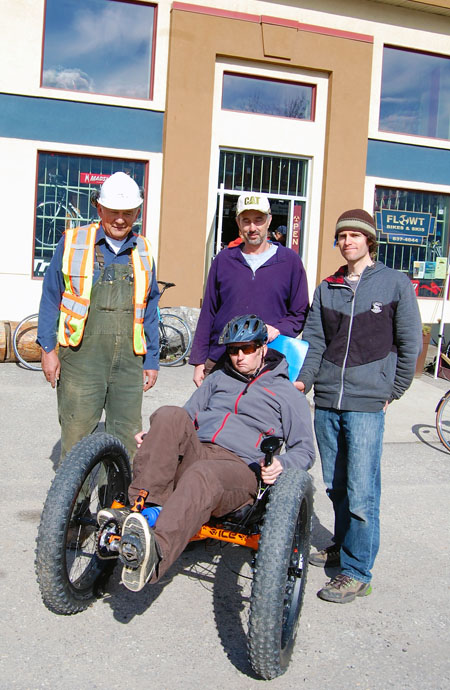 Chris Miller poses in the new off-road-capable trike acquired for him by friends Peter Bernacki, Shane Volpatti and Flowt Bike Shop owner Brendan MacIntosh. Miller suffered a debilitating stroke last year and has been in recovery ever since. His friends organized a fund-raising campaign to help him acquire the $8,400 trike that gives him the capability to use the mountain bike trails he loves in the area. Chris said he has tried it out along the Columbia River below the Big Eddy and Trans-Canada Highway bridges and is looking forward to trying it out on the trail to Mount Revelstoke National Park that starts just above the Railway Museum. That trail could take him to the two-kilomtre and five-kilometre loops on the lower flank of the mountain. Brendan said this English-made machine by Inspired Cycle Engineering was the best choice for Chris. It is very well-designed, has superior clearance and is very durable. David F. Rooney photo