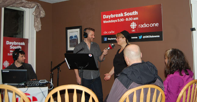 CBC Radio's Daybreak host Chris Walker interviews Shelley Klassen about what drives her at the Main Street Cafe as sound man Adrian Nieoczym (left) and guests Rob Elliott and Judy Goodman look on. The popular morning radio program is usually broadcast from the CBC's studios in Kelowna but periodically its host and a technician go on the road broadcasting to their thousands of listeners from other cities, towns and villages in the region. This show was broadcast from the cafe between 6 am and 8:30 am on Friday, March 13. Curious residents dropped by the cafe for a terrific breakfast and chance to watch the show. David F. Rooney photo
