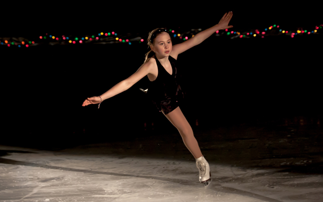 The last solo act of the night, Lauryn Kline, soars across the frozen indoor pond of the arena. Jason Portras photo