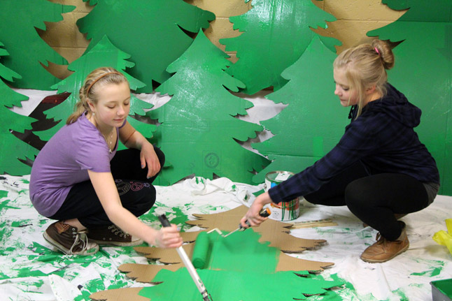 Alexis Larsen (left) and Alexandra Robertson (right) help paint props for the upcoming 'Name that Movie' ice show March 12. Photo courtesy of Jennifer Walker-Larsen