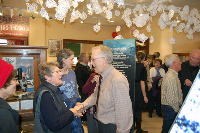 John Woods, researcher and writer on the Revelstoke Museum & Archives long-awaited Land of Thundering Snow virtual museum project, greets Mengia Nicholson at the start of the Museum's unveiling of the physical exhibition attached to the show. David F. Rooney photo