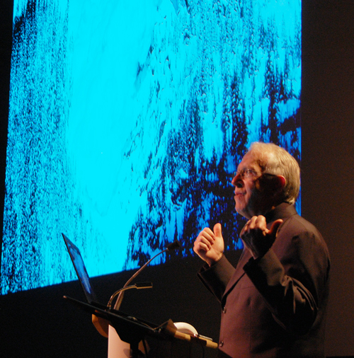 John Woods talks to an audience of about 200 people at the Performing Arts Centre about the many different features on the www.landofthunderingsnow.ca website. David F. Rooney photo